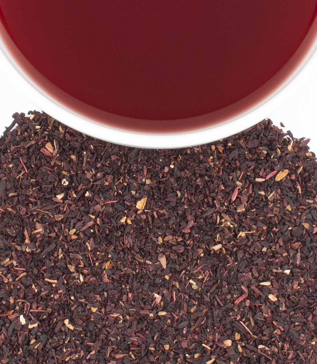 Box of 20 premium hibiscus teabags with dried hibiscus flowers and brewed tea in a cup.