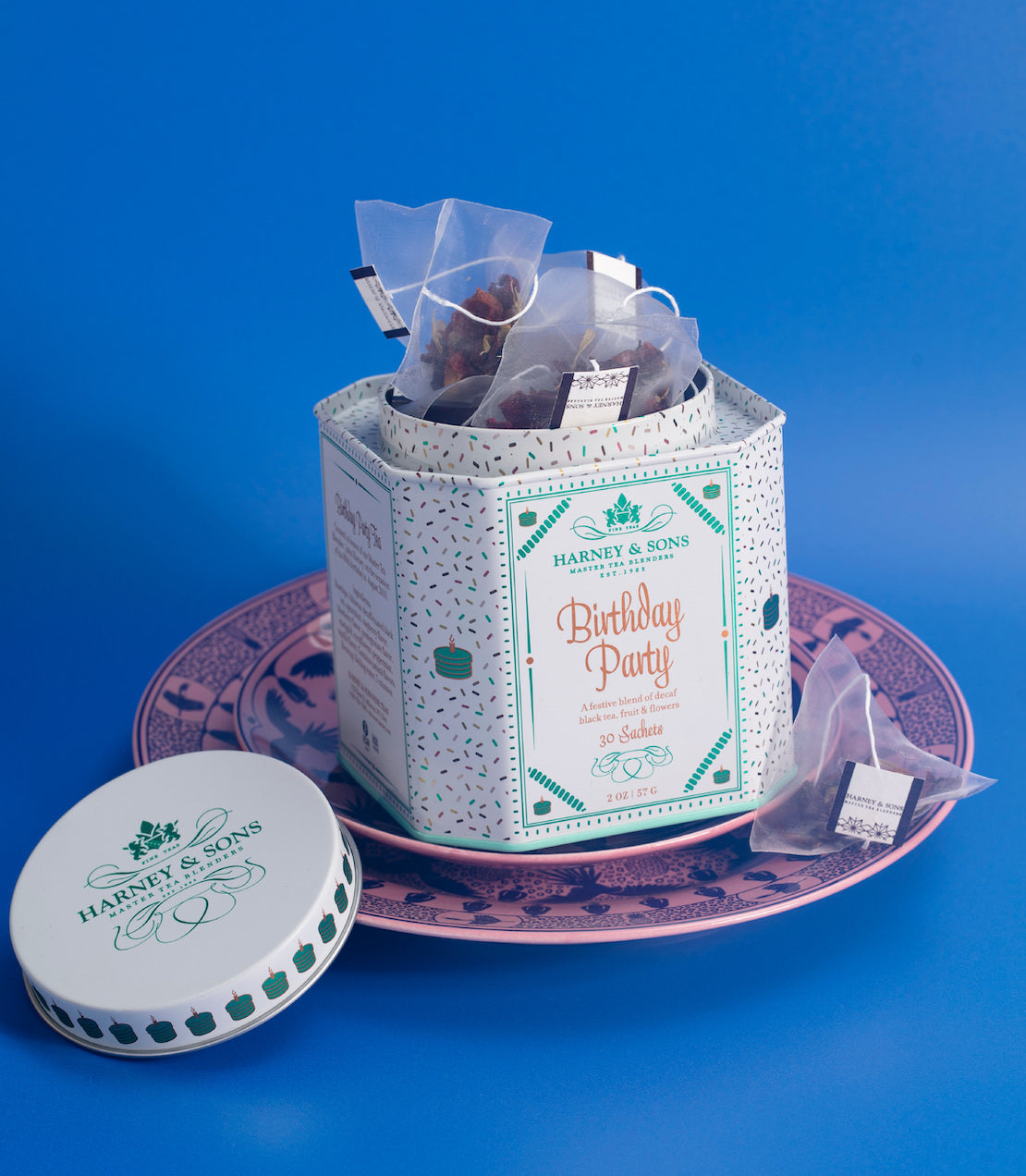 Birthday tea tin on a blue background.
